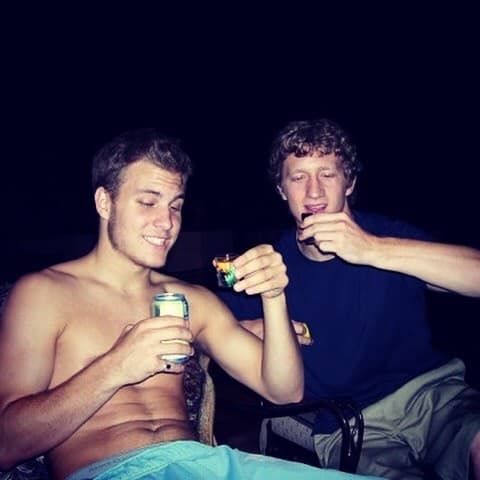 Isaac Hess and his best friend Chris raising shots on August 8, 2005, a couple of weeks after his hip replacement