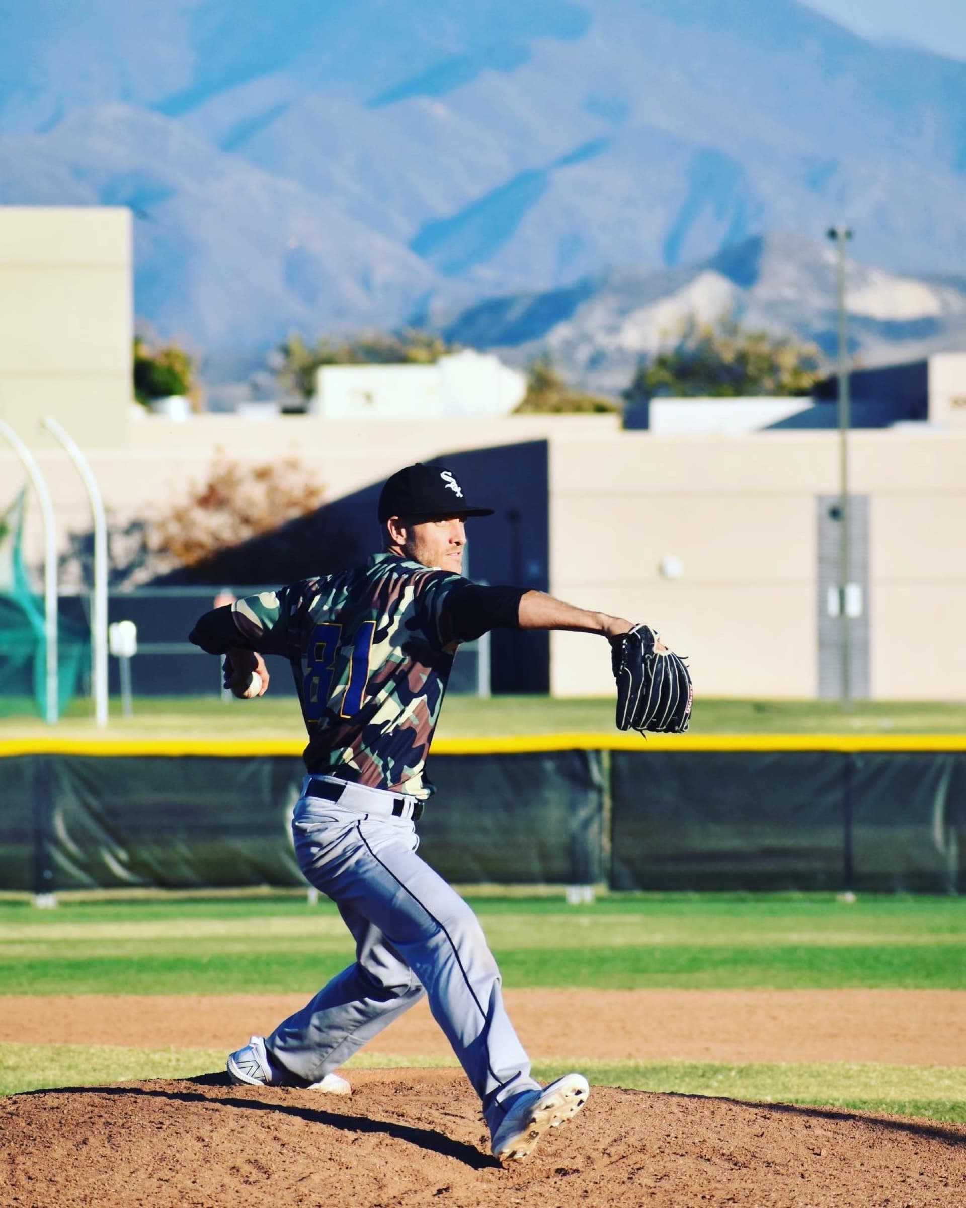 Isaac Hess mid-delivery on the mound, 2022